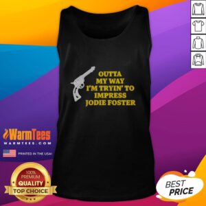 Man wearing a 'Top Outta My Way I'm Tryin' to Impress Jodie Foster' gun tank top, showcasing a casual, humorous style.