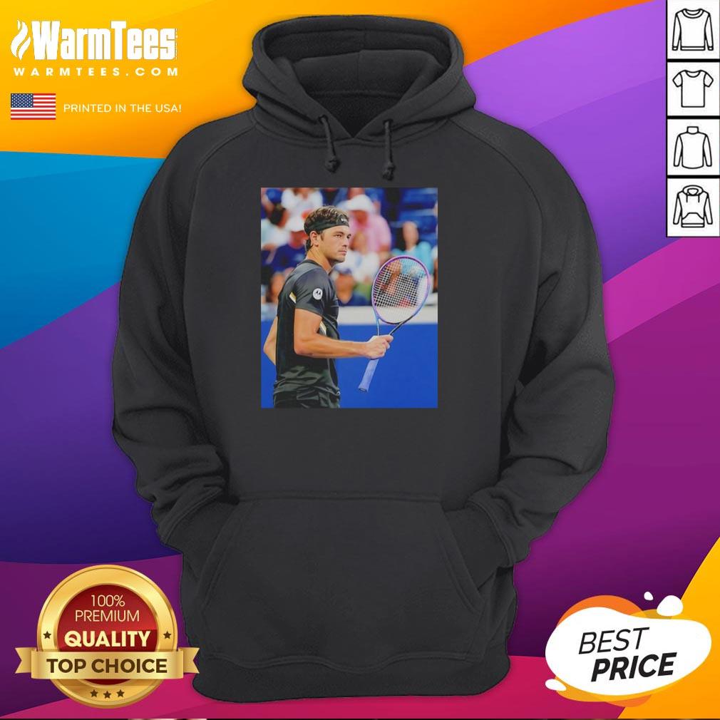 Taylor Fritz wearing a stylish hoodie at the 2025 US Open Tennis, showcasing his athletic style and competitive spirit.