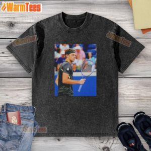 Taylor Fritz wearing a stylish washed t-shirt during the 2025 US Open tennis tournament.