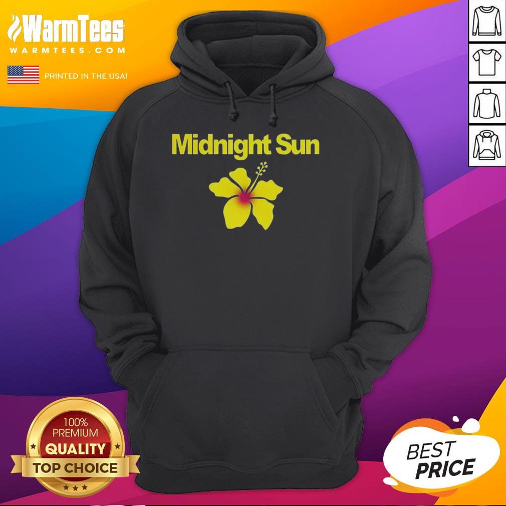 Zara Larsson wearing a stylish Midnight Sun hoodie, showcasing a trendy streetwear look in vibrant colors.