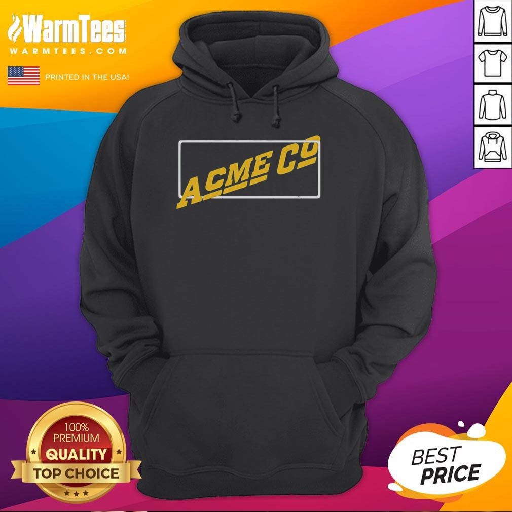 Vintage Acme Co hoodie displayed on a wooden background, showcasing its retro design and comfortable fit.