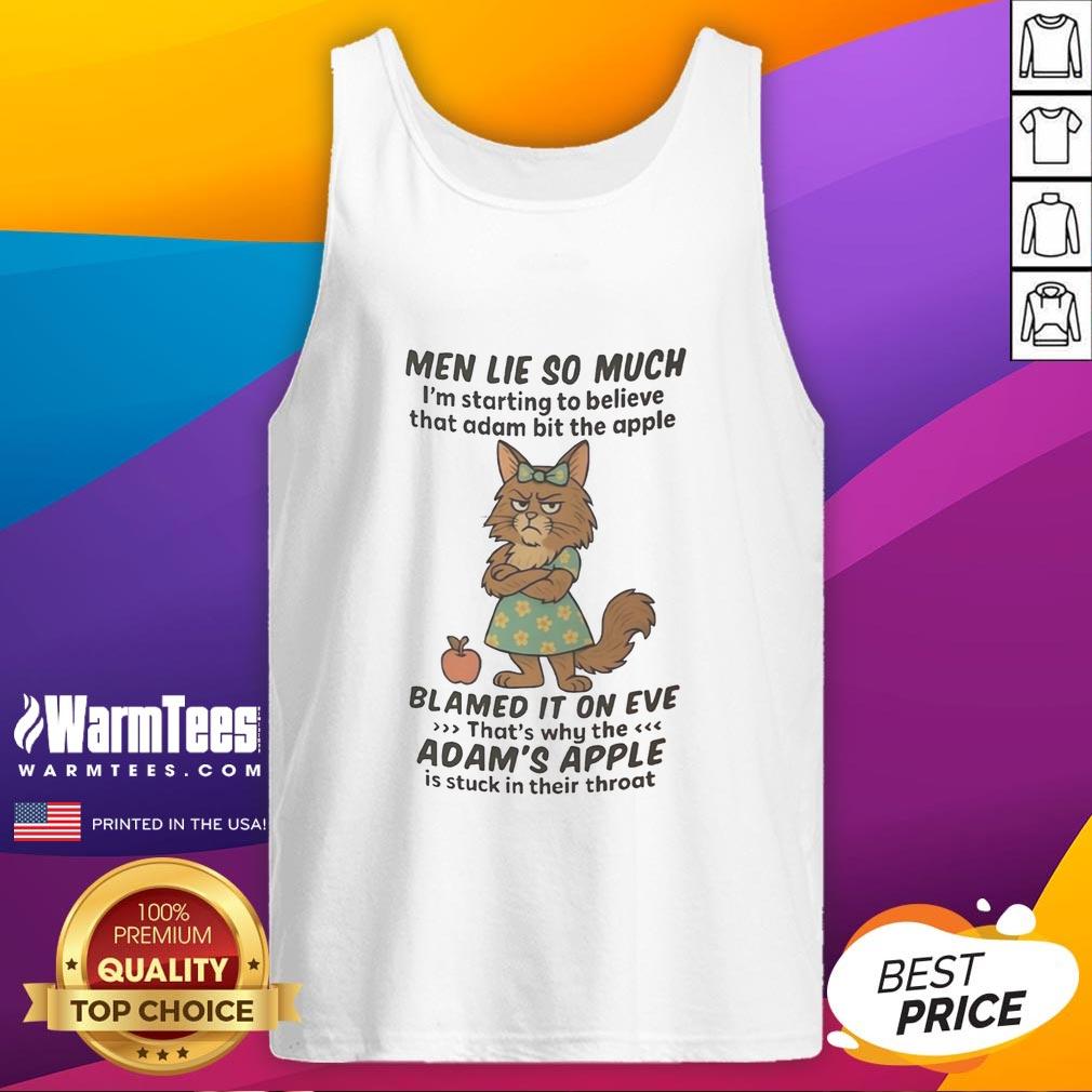 Adorable Maine Coon cat in a tank top, showcasing its playful personality and charm in a cozy setting.