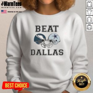 Top Coach Nick Sirianni wearing a Dallas Beat sweatshirt, showcasing team spirit and style during a football event.