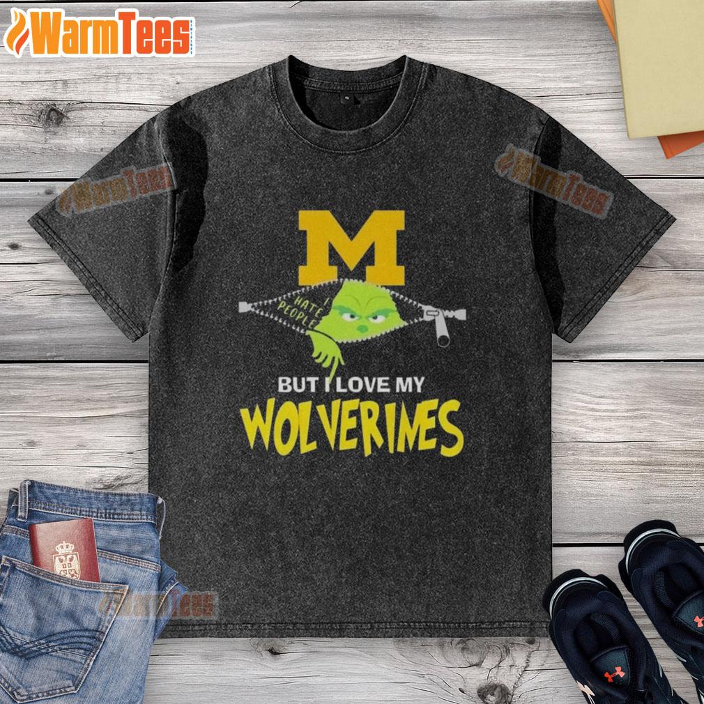 Alt Text: Awesome Grinch Christmas design on a Michigan Wolverines washed t-shirt, perfect for holiday cheer and team spirit.