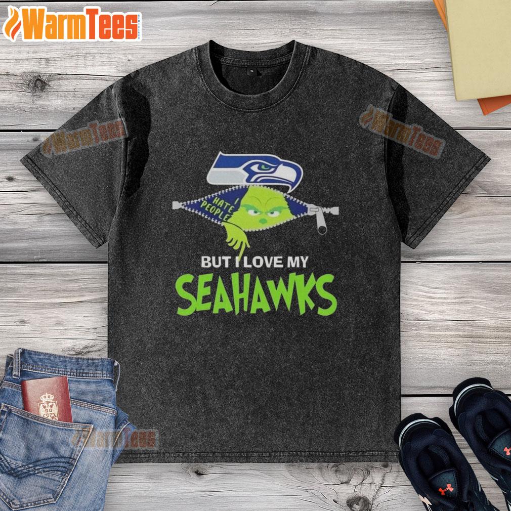 Alt Text: Awesome Grinch Christmas washed t-shirt featuring Seattle Seahawks logo, perfect for holiday NFL fans.