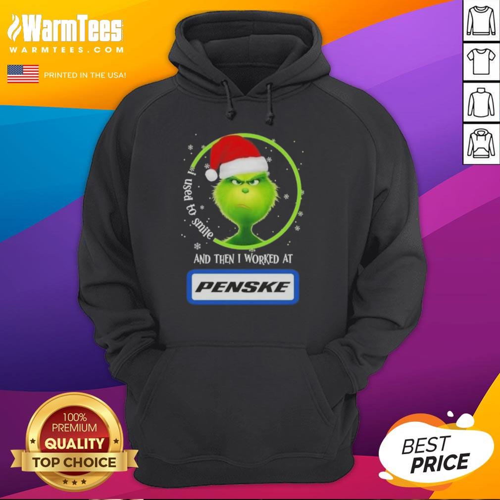 Alt Text: Funny Grinch Christmas hoodie with 'I Used to Smile and Then I Worked at Penske Corporation' text design.