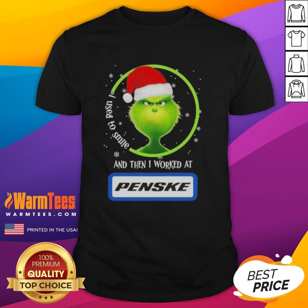 Funny Grinch Christmas t-shirt with the quote 'I Used To Smile And Then I Worked At Penske Corporation'
