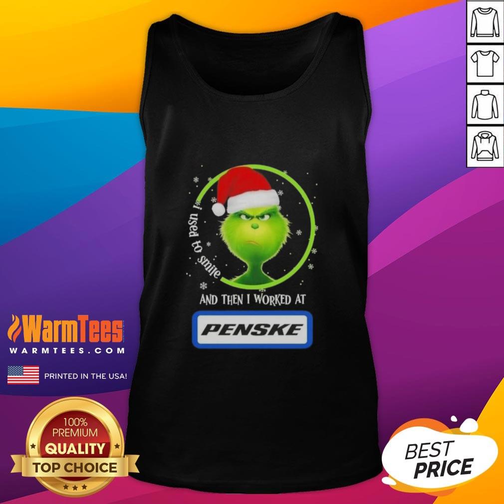Alt Text: Funny Grinch Christmas tank top featuring a humorous quote about smiling and working at Penske Corporation.