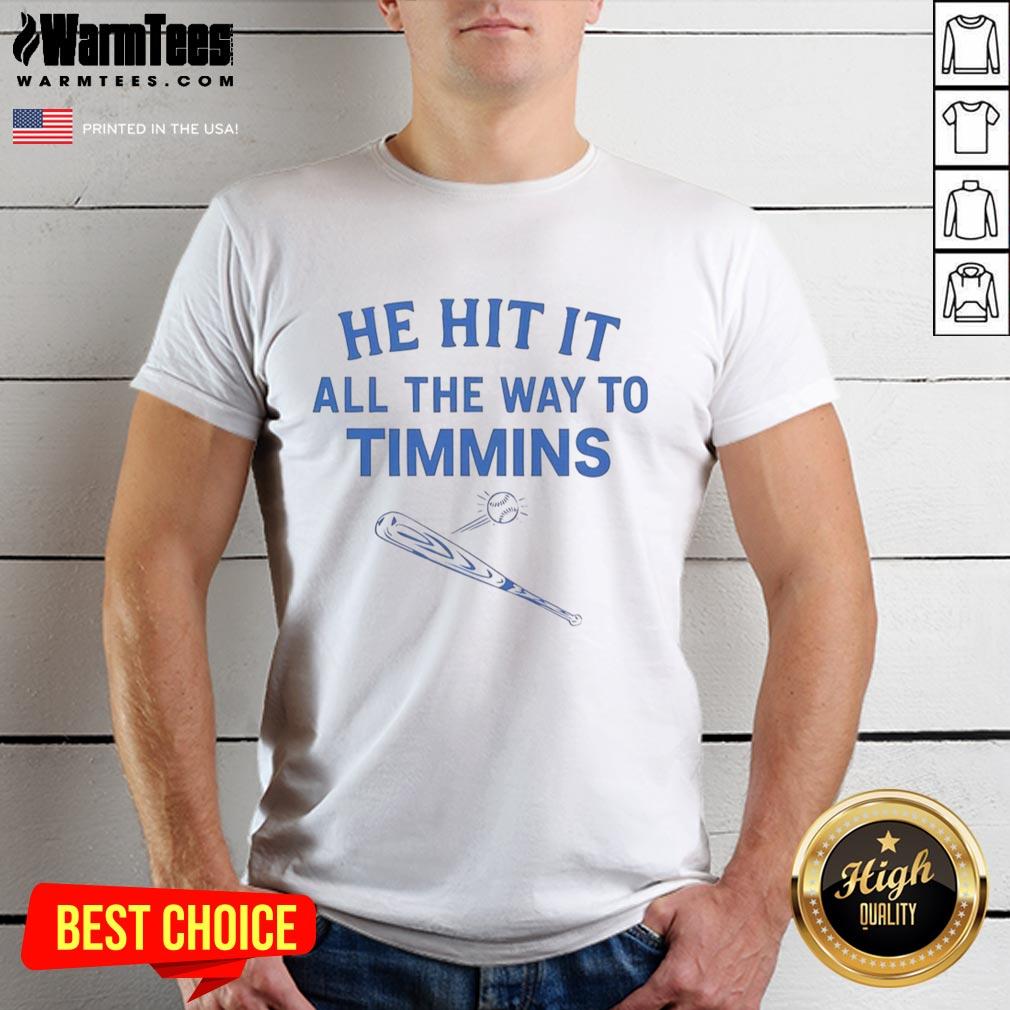 Alt Text: Good He Hit It All The Way To Timmins T-Shirt featuring bold text design in vibrant colors.