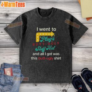 Person wearing a 'Nice I Went To Plugs Butt Ugly Stuff Hut' washed t-shirt, showcasing a fun and quirky design.