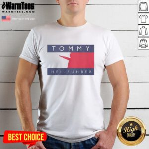 Alt Text: Official Tommy Heilfuhrer logo parody T-shirt featuring a humorous design with bold graphics and vibrant colors.
