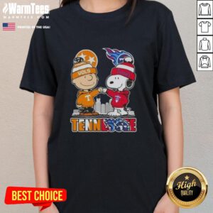 Premium Charlie Brown and Snoopy Tennessee Vols x Titans skyline ladies tee featuring vibrant colors and playful design.