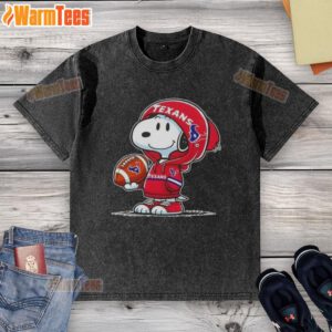 Alt Text: Cute Peanuts Snoopy in a Houston Texans hoodie, smiling at fans, featured on a washed t-shirt design.