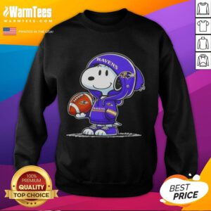 Snoopy in a Baltimore Ravens hoodie smiles at fans, showcasing the Good Peanuts sweatshirt design. Perfect for football fans!