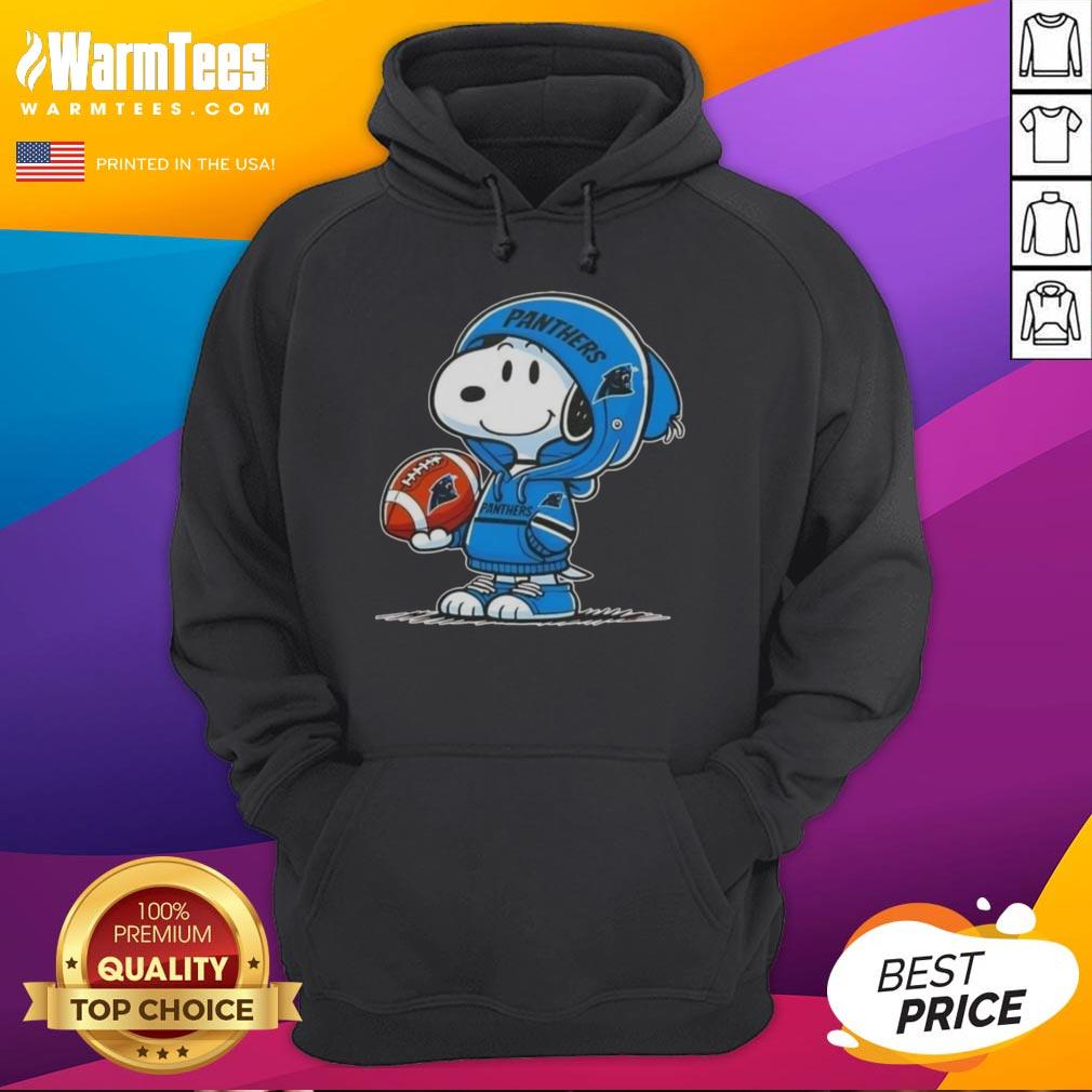 Snoopy wearing a Carolina Panthers hoodie, smiling at fans in a vibrant setting, showcasing the Good Peanuts collection.