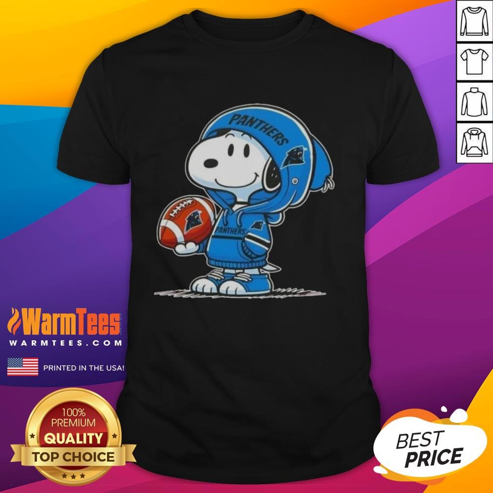 Alt Text: Good Peanuts Snoopy in a Carolina Panthers hoodie smiling at fans on a fun graphic T-shirt.