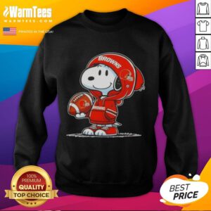 Alt Text: Snoopy wearing a Cleveland Browns hoodie, smiling at fans while showcasing a cozy sweatshirt featuring good peanuts design.