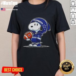 Snoopy in a Dallas Cowboys hoodie smiles at fans on a ladies tee, showcasing fun peanut-themed design.