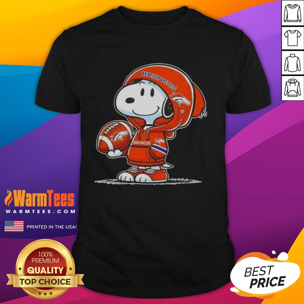 Alt Text: Snoopy in a Denver Broncos hoodie smiles at fans on a fun t-shirt featuring Good Peanuts character design.