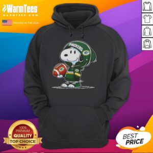 Good Peanuts Snoopy wearing a Green Bay Packers hoodie, smiling at fans in a cheerful, playful atmosphere.
