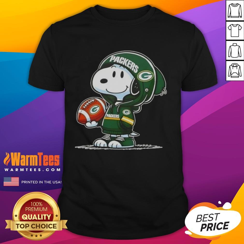 Alt Text: Snoopy in a Green Bay Packers hoodie smiling at fans on a fun Good Peanuts T-shirt design.