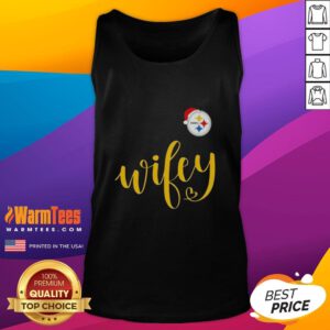 Happy Wifey in a Pittsburgh Steelers tank top wearing a Santa hat, celebrating Christmas cheerfully.