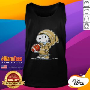 Snoopy in a hoodie smiles at fans while wearing a New Orleans Saints tank top, showcasing his love for football.