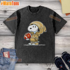 Alt Text: Snoopy in a hoodie, smiling at fans while wearing a New Orleans Saints washed t-shirt, showcasing pretty peanuts style.