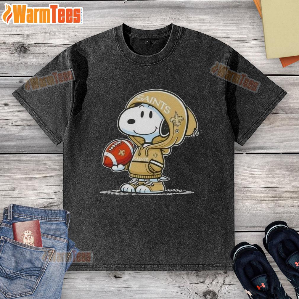 Alt Text: Snoopy in a hoodie, smiling at fans while wearing a New Orleans Saints washed t-shirt, showcasing pretty peanuts style.