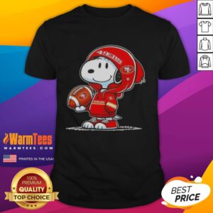 Alt Text: Snoopy in a hoodie smiles at fans, showcasing a San Francisco 49ers T-shirt, perfect for sports lovers.