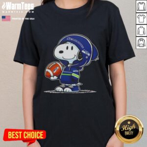 Alt Text: Snoopy in a Seattle Seahawks hoodie smiles at fans, featured on a Pretty Peanuts ladies tee, perfect for football lovers.