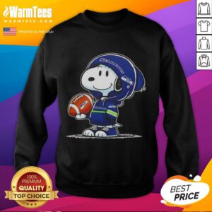Snoopy wearing a Seattle Seahawks hoodie, smiling at fans, featured on a Pretty Peanuts sweatshirt.