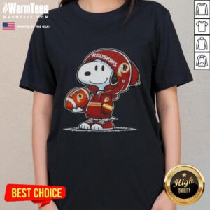 Alt Text: Snoopy in a hoodie, smiling at fans, wearing Washington Commanders gear on a ladies' tee, showcasing Pretty Peanuts design.