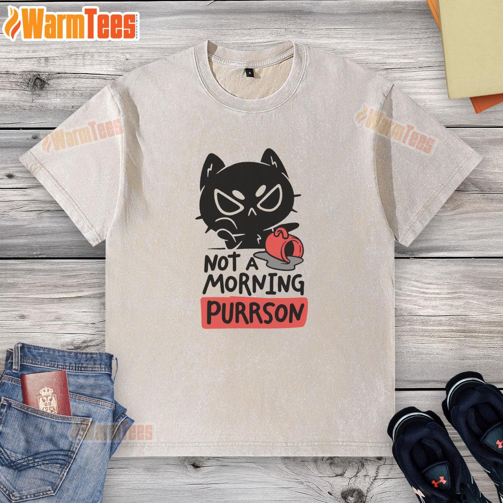 Funny cat wearing a 'Not a Morning Purrson' washed t-shirt, showcasing its playful attitude and humor.