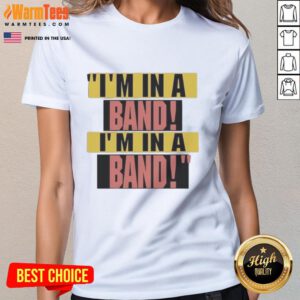Hayley Williams wearing a stylish I'm in a Band ladies tee, showcasing her unique fashion sense and love for music.