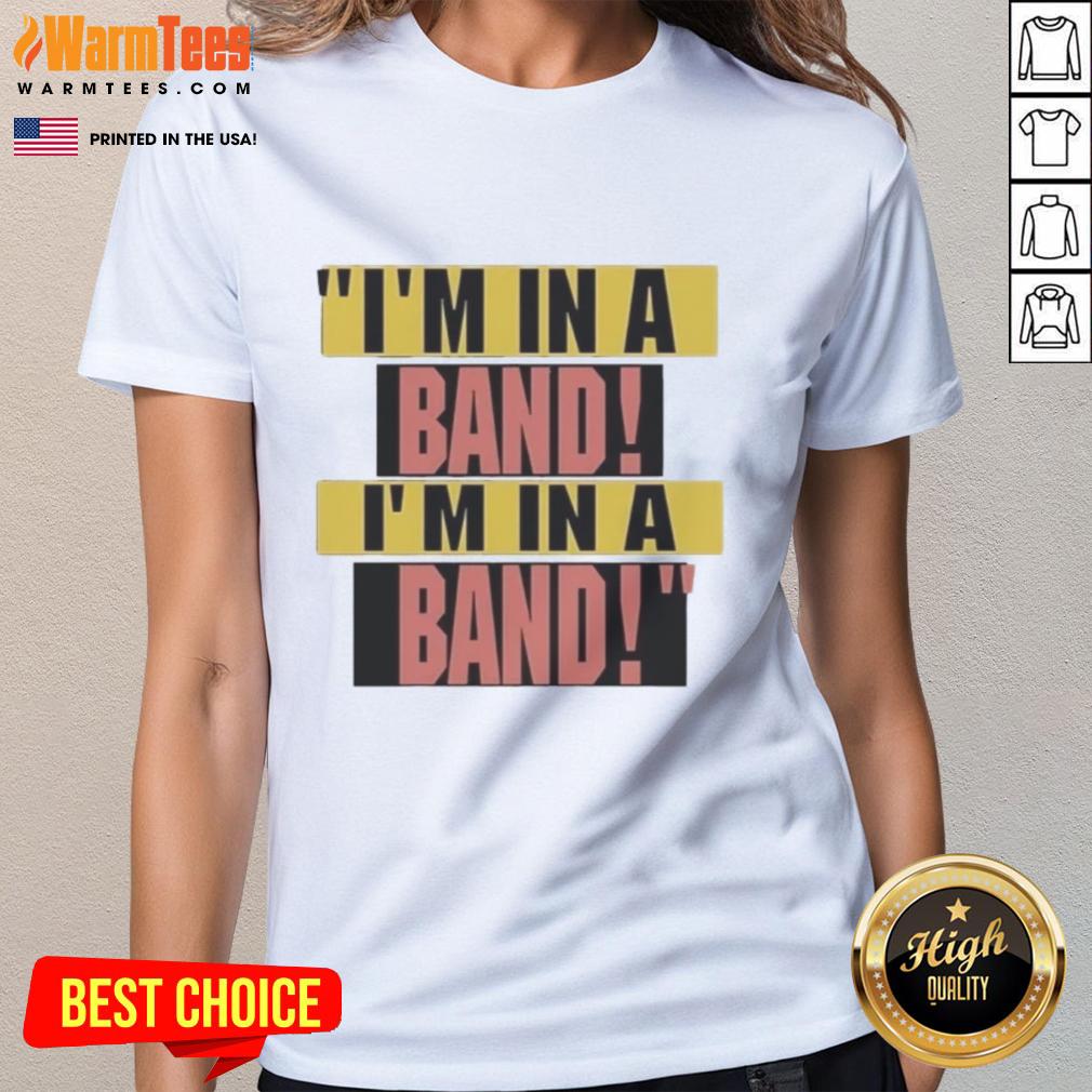 Hayley Williams wearing a stylish I'm in a Band ladies tee, showcasing her unique fashion sense and love for music.