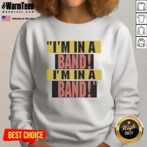 Alt Text: Hayley Williams wearing a stylish I'm In A Band sweatshirt, showcasing her unique fashion sense and musical passion.