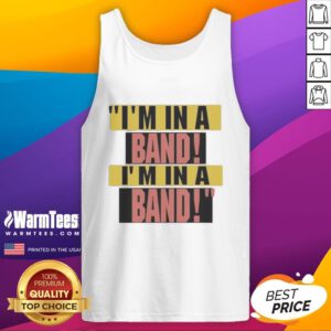 Hayley Williams wearing 'I'm In A Band' tank top, showcasing her unique style and passion for music in a vibrant setting.