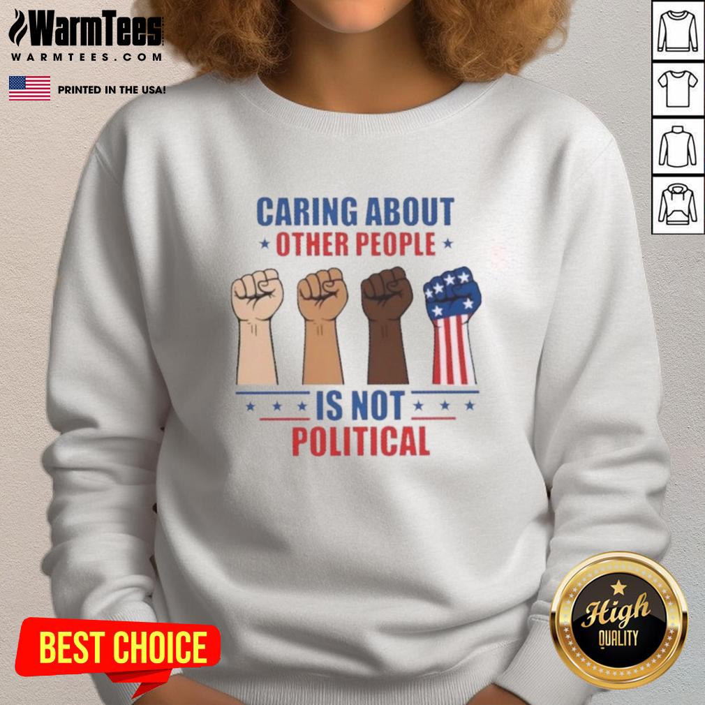 Alt Text: Hot Caring About Other People Is Not Political Fists Sweatshirt featuring a bold graphic design on a cozy sweatshirt.