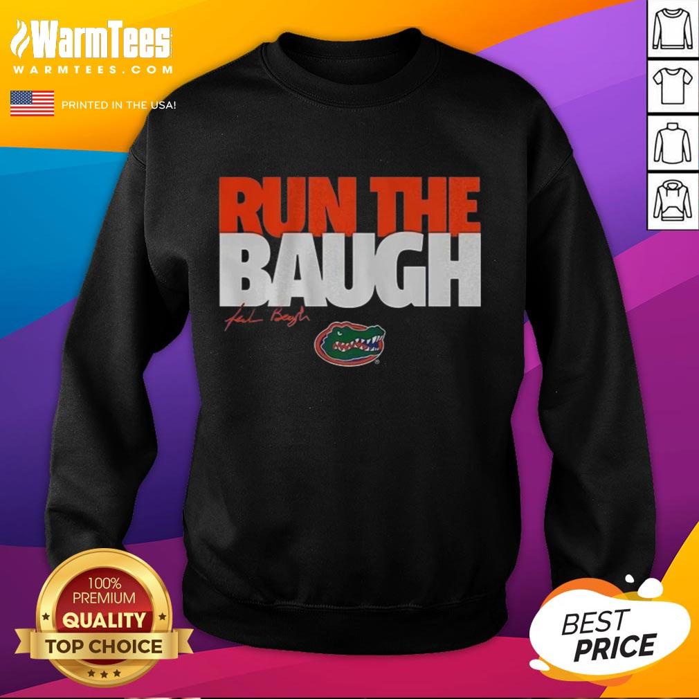 Alt Text: Jadan Baugh running in a Nice Florida Gators sweatshirt, showcasing team spirit and sporty style.