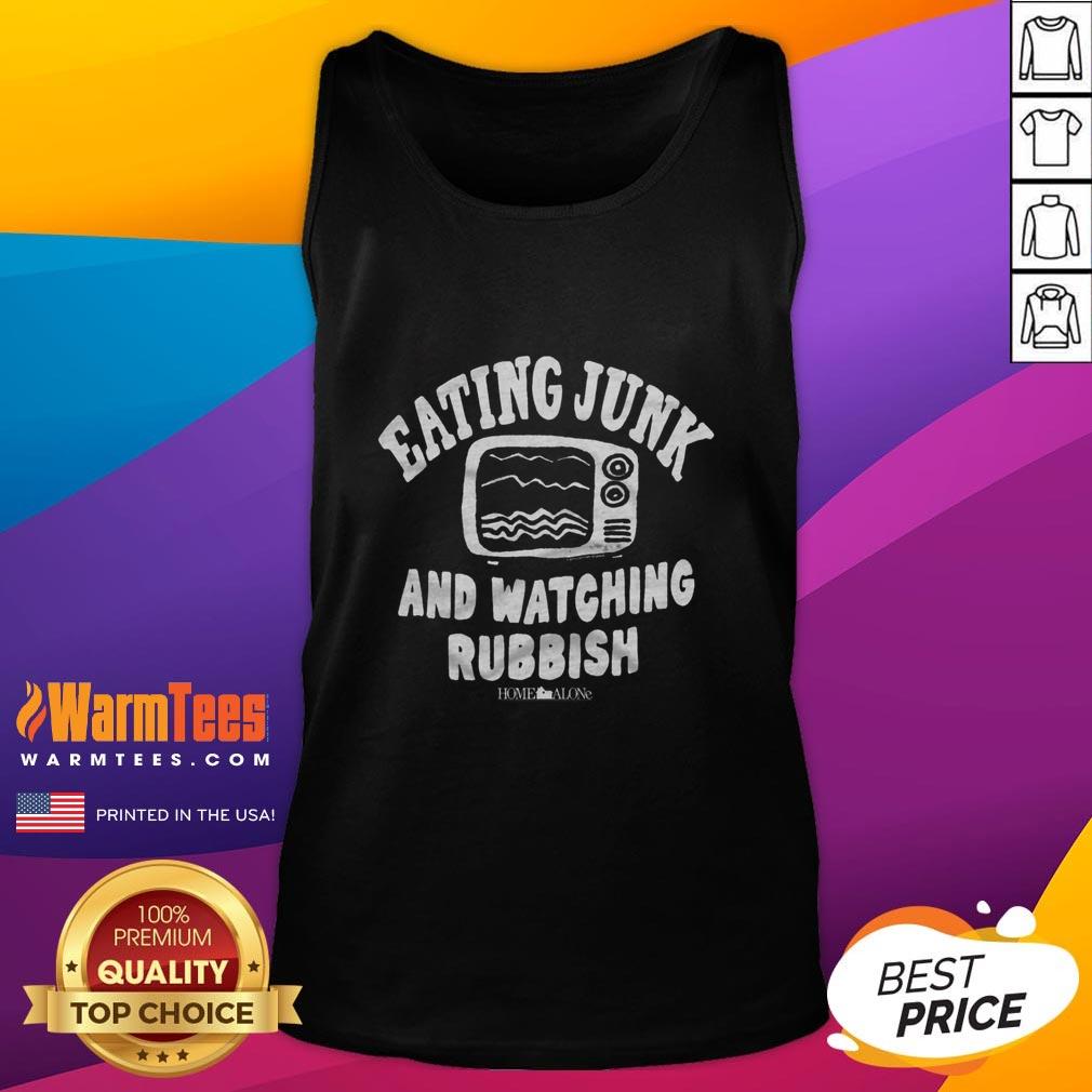 Person in a tank top enjoying junk food while watching TV, embodying the 'Home Alone' vibe of relaxation and indulgence.