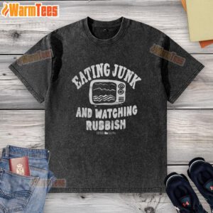 Person in a 'Home Alone' washed t-shirt enjoying junk food while watching TV, embodying the perfect relaxed night in.