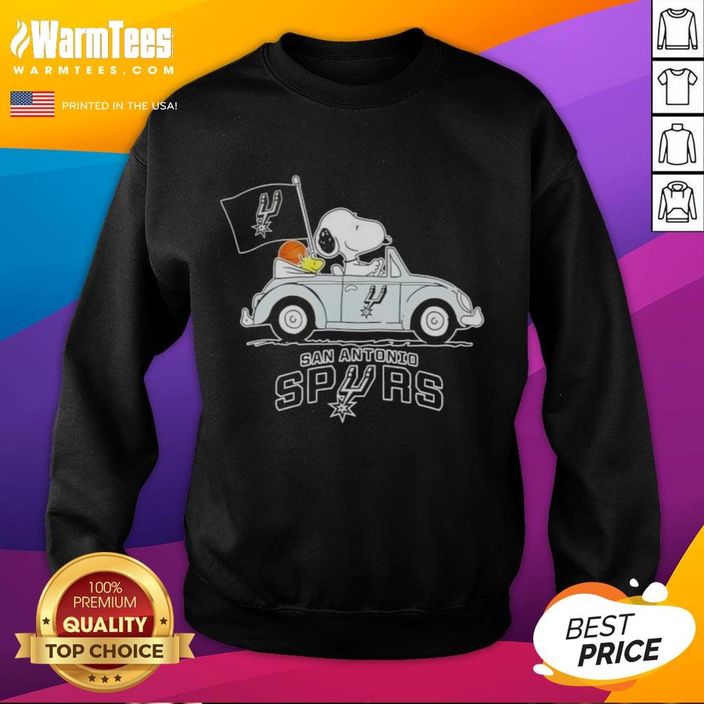 Alt Text: Snoopy driving a car wearing a San Antonio Spurs basketball sweatshirt, showcasing a fun sports-themed design.