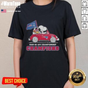 Alt Text: Snoopy and Woodstock celebrate in a New England Patriots car for the AFC Championship 2025-26 on a ladies' tee.