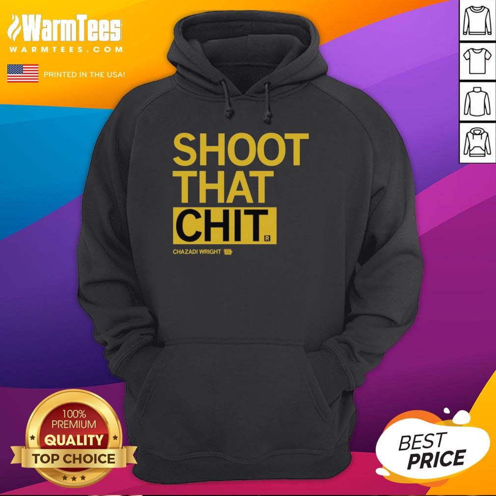 Chazadi Wright wearing the Shoot That Chit hoodie, showcasing stylish streetwear in a vibrant urban setting.