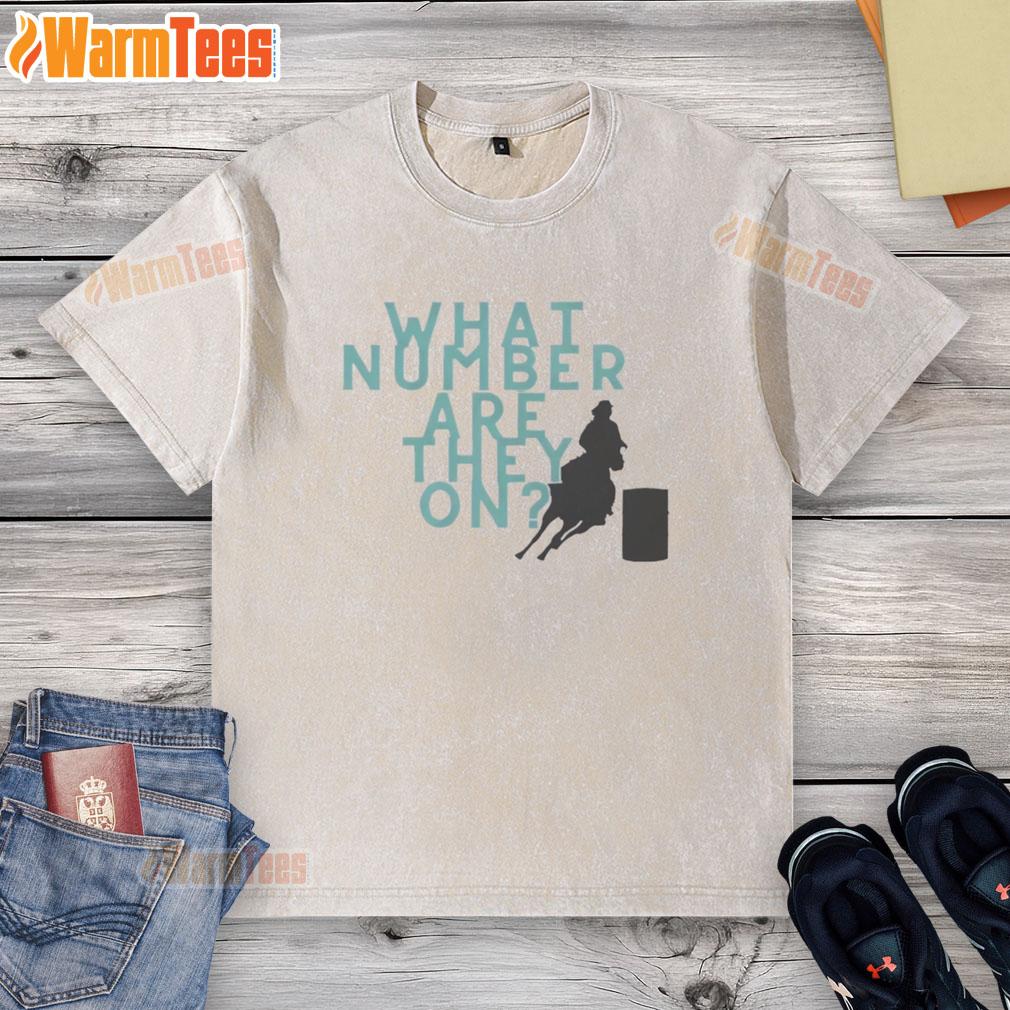 Stylish washed t-shirt with playful 'What Number Are They On' graphic, perfect for casual wear and trendy outfits.