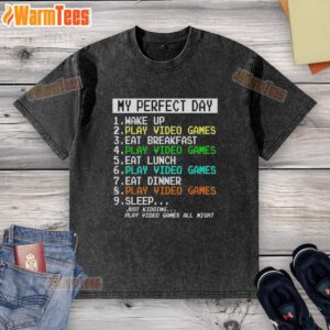 Alt Text: Retro washed t-shirt featuring 'My Perfect Day' graphic with video games, breakfast, and a fun wake-up theme.