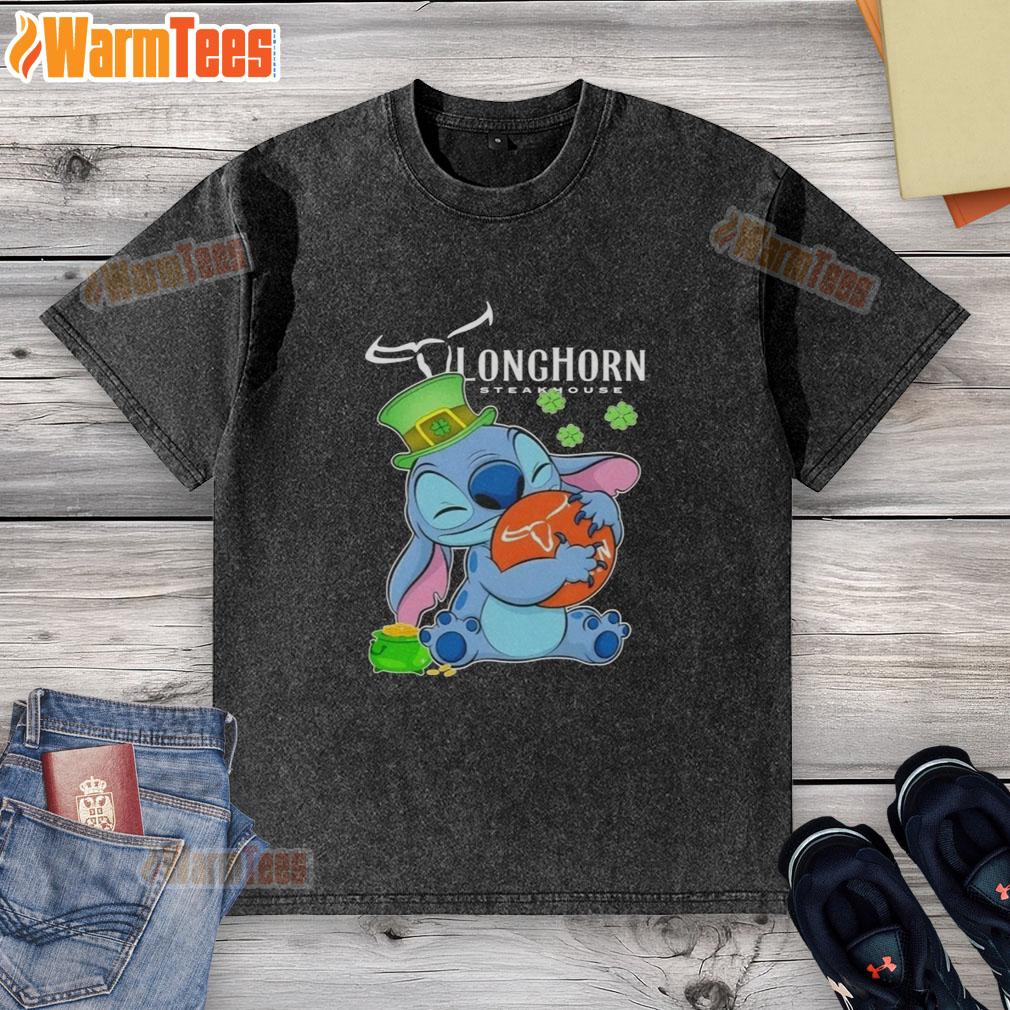 Alt Text: Cute Stitch hugging Texas Longhorn Steakhouse logo on a happy St. Patrick's Day washed t-shirt design.