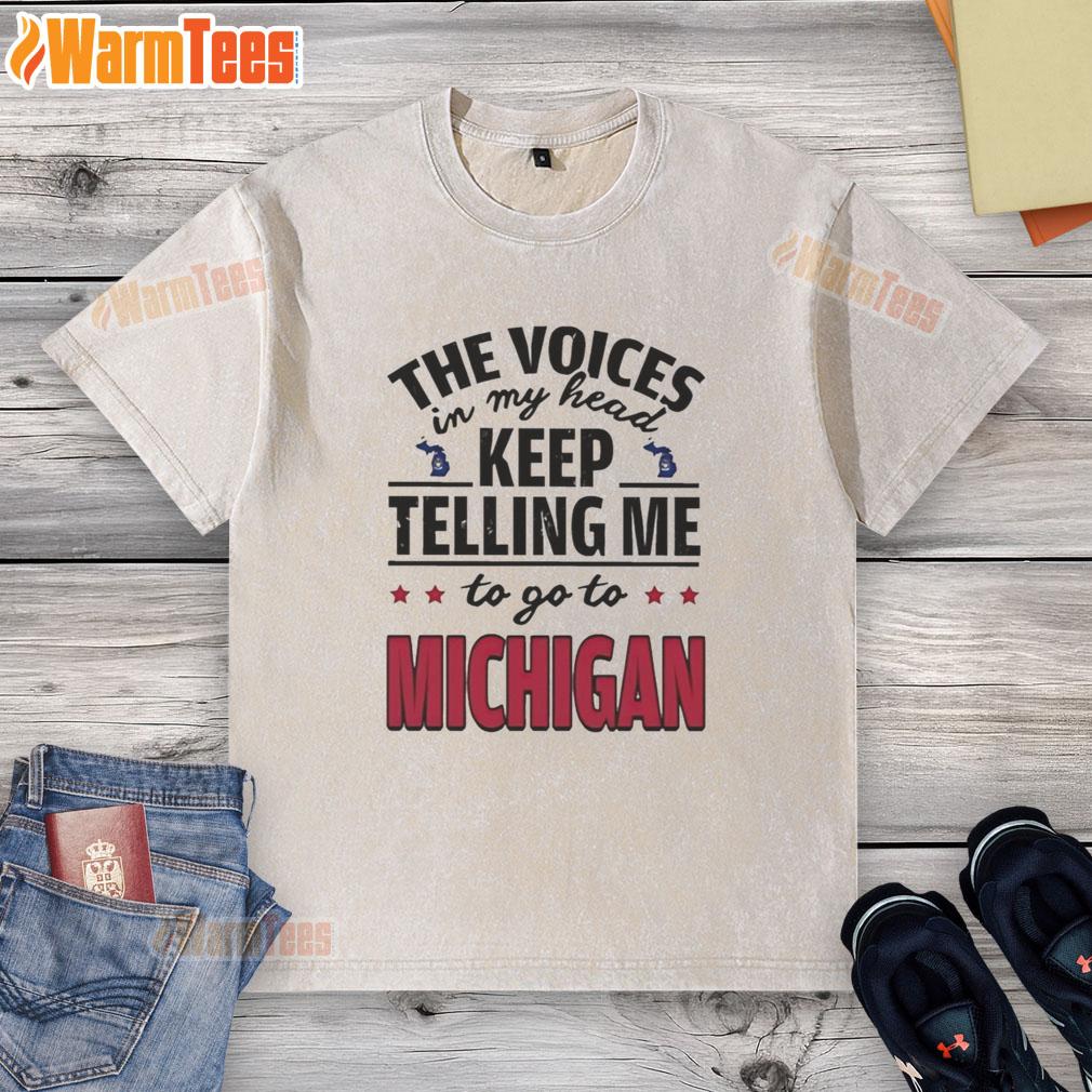 Alt Text: Funny washed t-shirt featuring 'The voices in my head keep telling me to go to Michigan' design.