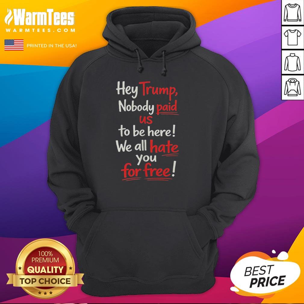 Protesters wearing 'Hey Trump, Nobody Paid Us To Be Here, We All Hate You For Free' hoodie during a rally.